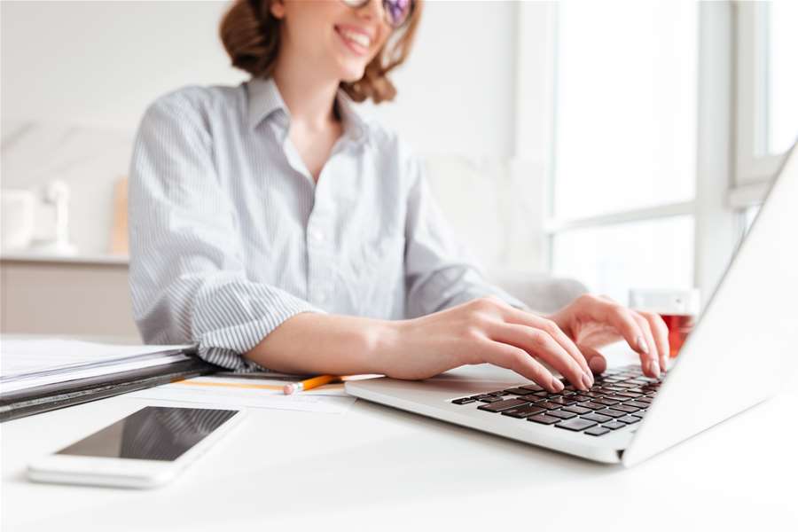 brunette-woman-typing-email-laptop-computer-while-sitting-home-selective-focus-hand (1).jpg