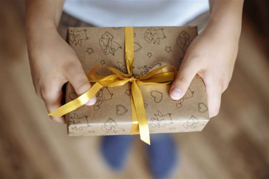 close-up-gift-box-hands-child_97780-776.jpg