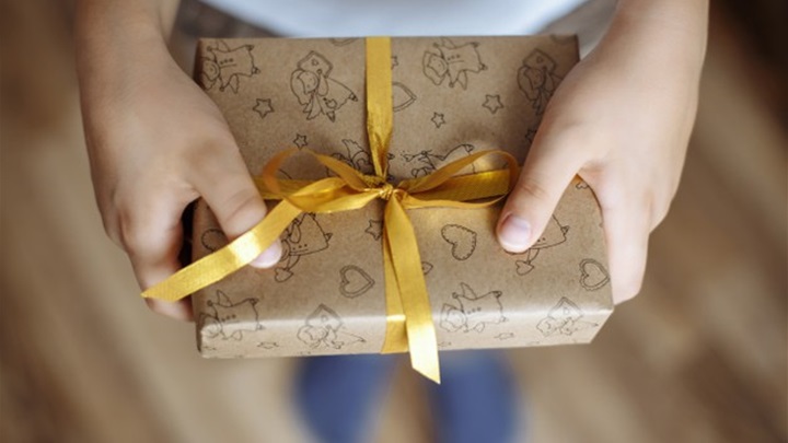 close-up-gift-box-hands-child_97780-776.jpg