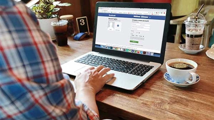 December-man-on-laptop-with-coffee-facebook-600x392-1.jpg