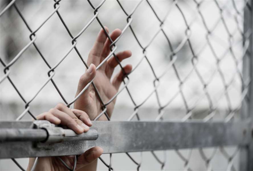 woman-hand-holding-chain-link-fence-remember-human-rights-day-concept_53476-132.jpg