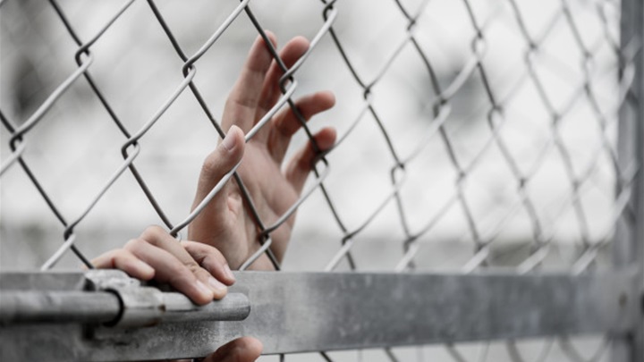 woman-hand-holding-chain-link-fence-remember-human-rights-day-concept_53476-132.jpg